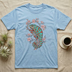 Blue t-shirt with a teal and orange chameleon on a cherry blossom branch.