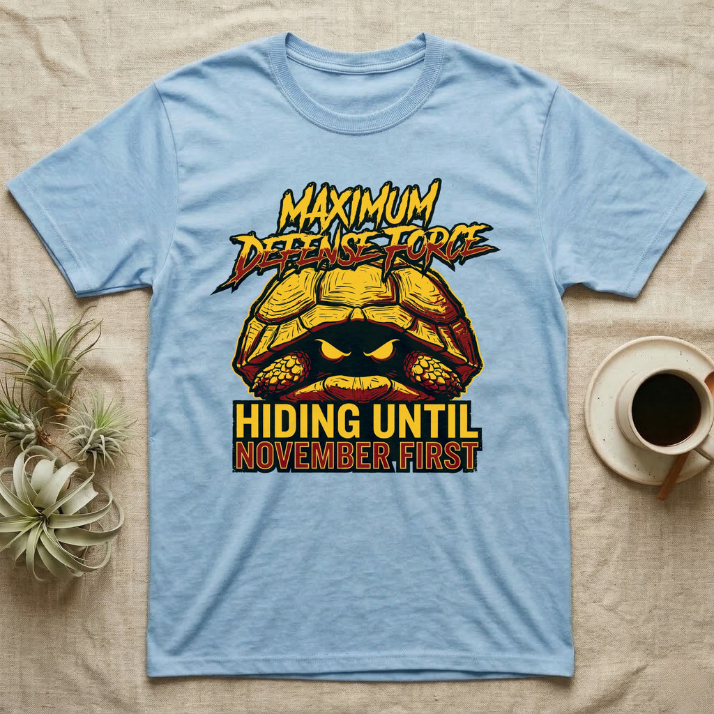 Tortoise Maximum Defense Force T-Shirt in Light Blue — Metal graphic of a tortoise glaring from its shell, "Maximum Defense Force, Hiding Until November First."