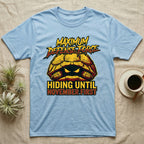Tortoise Maximum Defense Force T-Shirt in Light Blue — Metal graphic of a tortoise glaring from its shell, "Maximum Defense Force, Hiding Until November First."