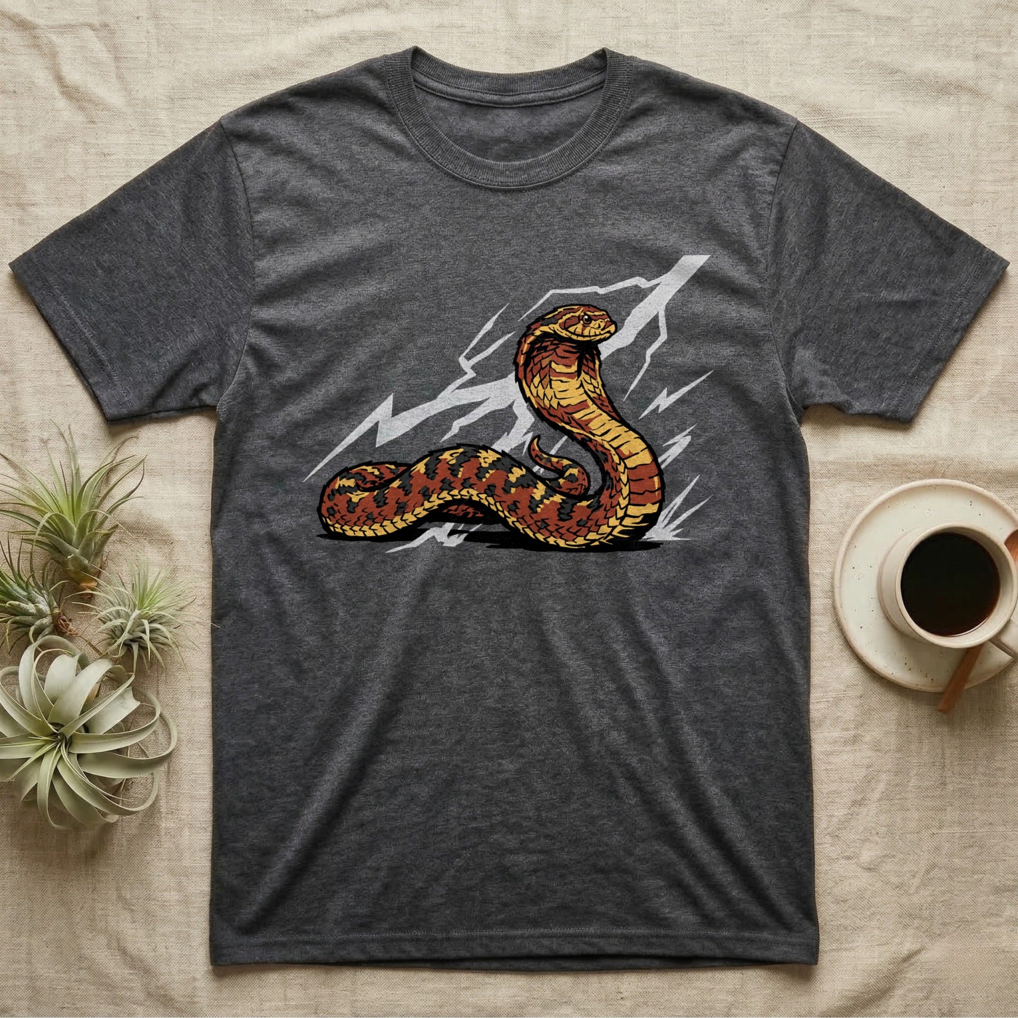 Dark grey t-shirt with a striking cobra graphic and lightning.