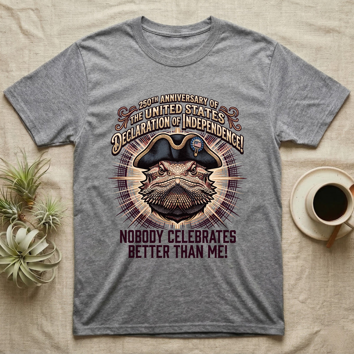 Bearded Dragon Declaration T-Shirt in Sport Grey — Ornate engraved bearded dragon portrait in a tricorn hat on a cream sunburst with Nobody Celebrates Better Than Me.