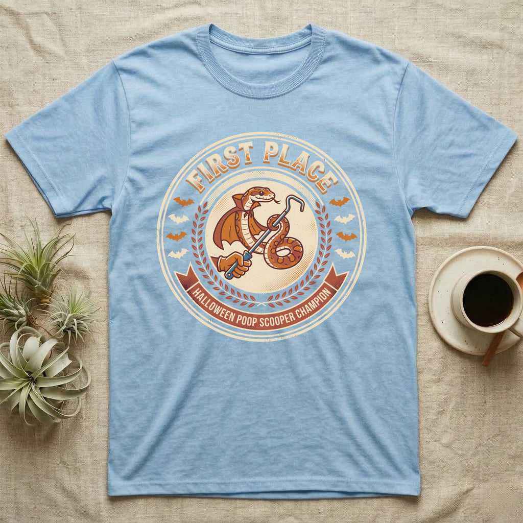 Corn Snake Poop Scooper Champion T-Shirt in Light Blue — Vintage award badge with a caped corn snake holding a scoop hook, "First Place Halloween Poop Scooper Champion."
