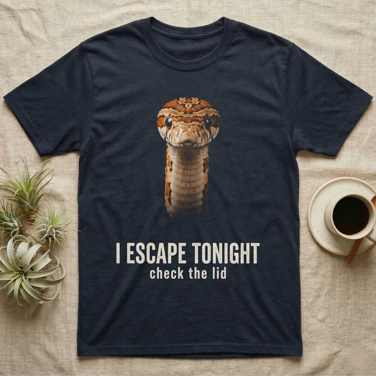 Photographic mugshot of a corn snake coiled and staring into the lens above the hook I Escape Tonight, check the lid. — shown on a Navy tee.