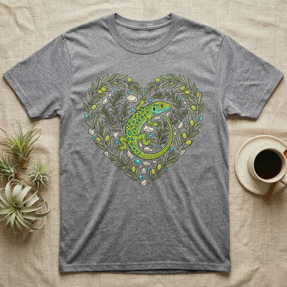 Grey t-shirt with green lizard and olive branch heart design.