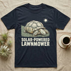 Solar Powered Lawnmower T-Shirt in Navy — Retro-illustration of a sulcata tortoise grazing a lawn stripe under a sun motif with a Solar-Powered Lawnmower caption.