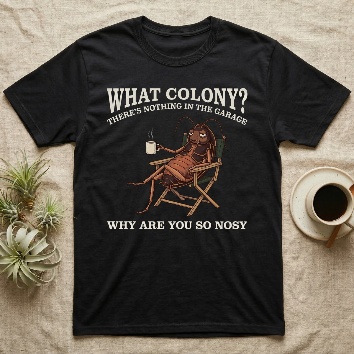 Reptile Roach Colony T-Shirt in Black — Vintage engraving of a dubia roach lounging in a camp chair with coffee under arched text What Colony on charcoal grey