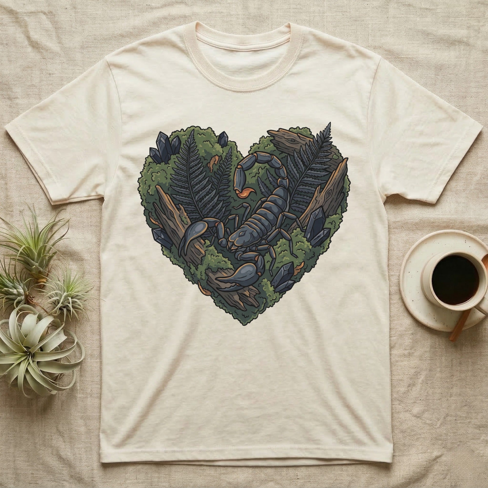 T-shirt with heart-shaped nature graphic featuring a scorpion, rocks, and ferns.