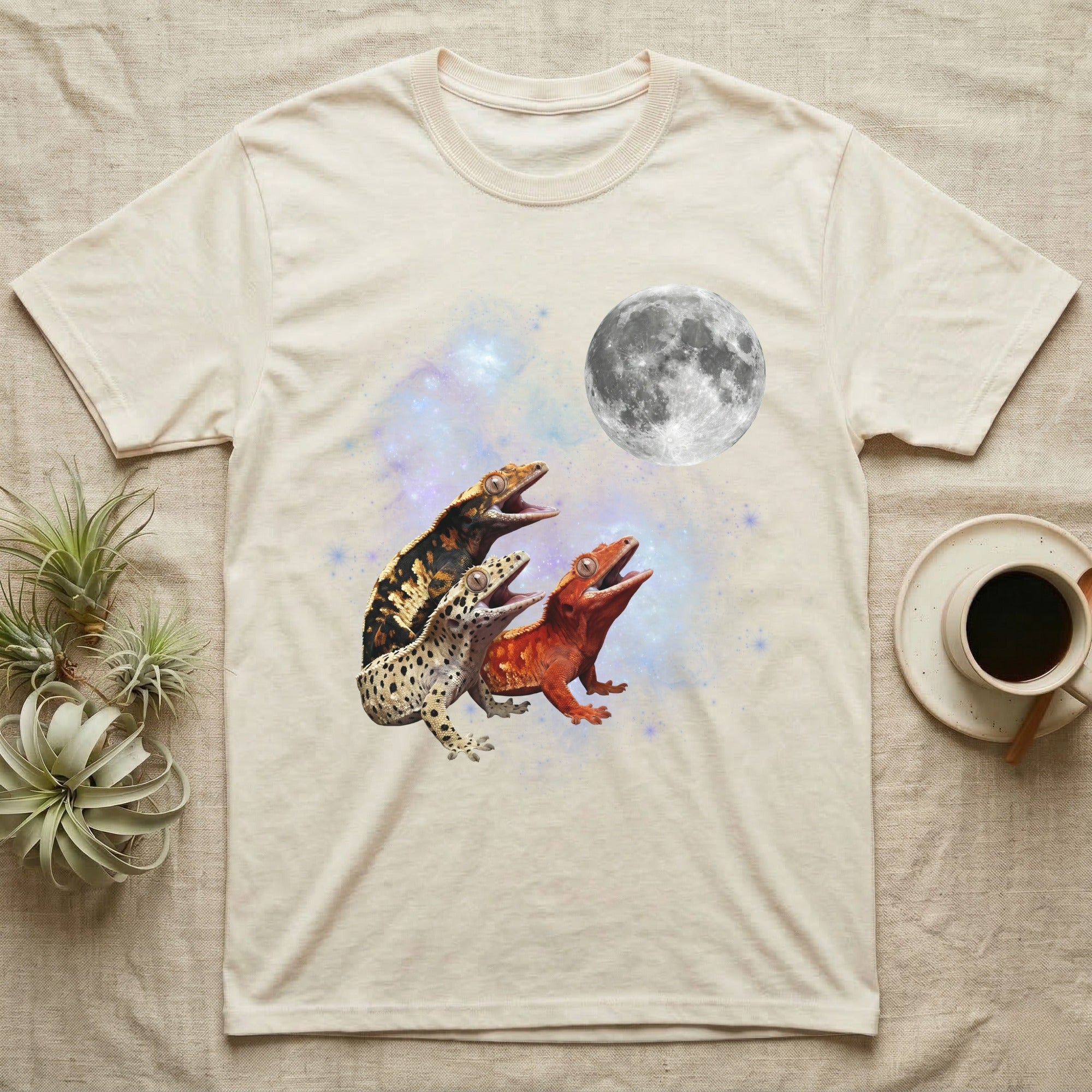 Crested Gecko Moon Howl T-Shirt in Natural — Three Crested Gecko colour morphs howling at a full moon over a nebula on a dark grey t-shirt.