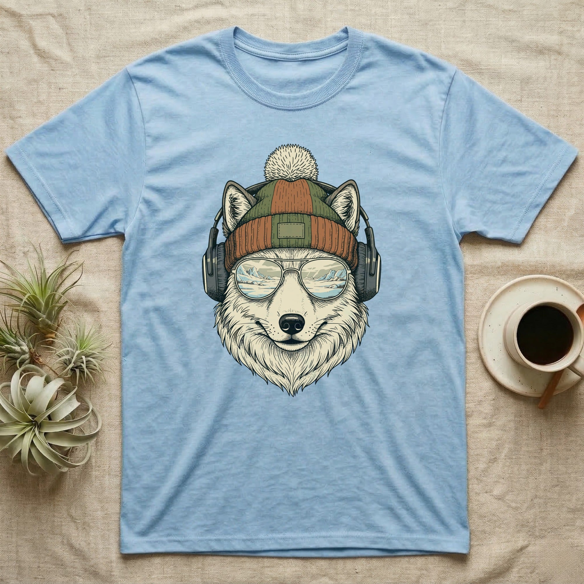 Blue t-shirt with illustration of a wolf wearing a beanie, sunglasses, and headphones.
