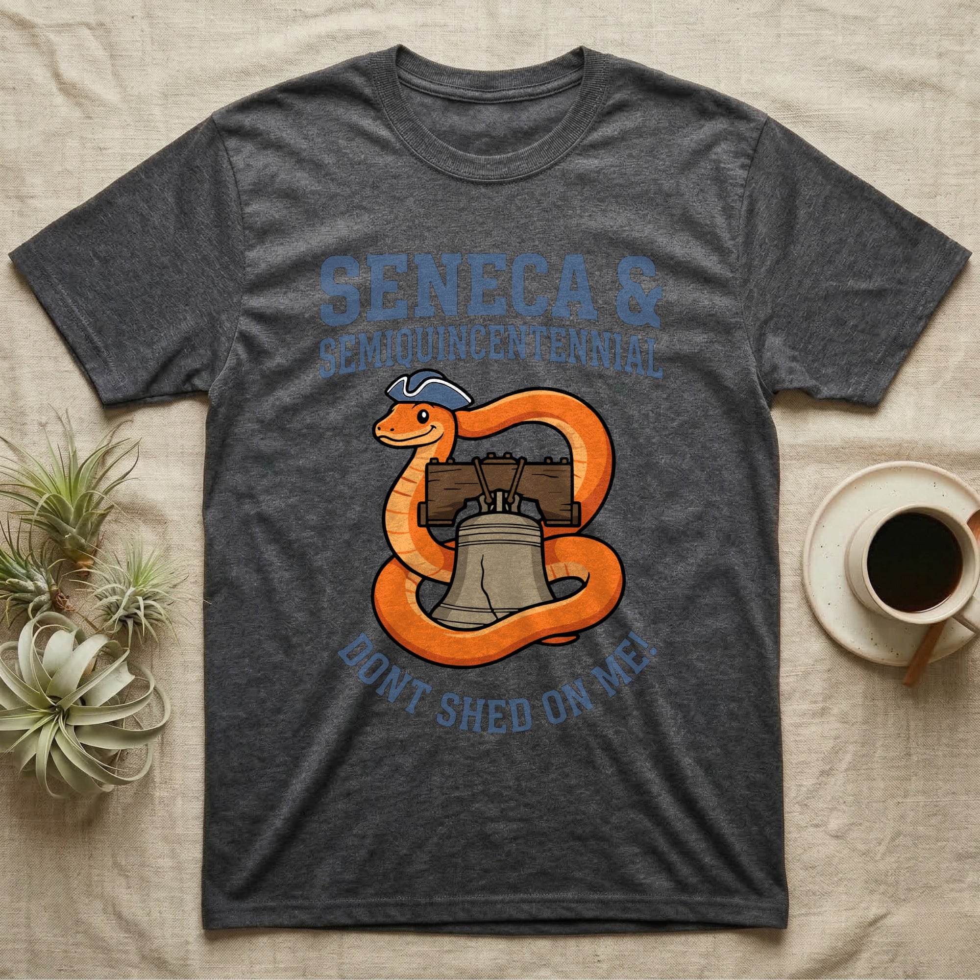 Corn Snake Don't Shed T-Shirt in Dark Heather — Cartoon orange snake in a tricorn hat coiled around the Liberty Bell with text Don't Shed On Me.