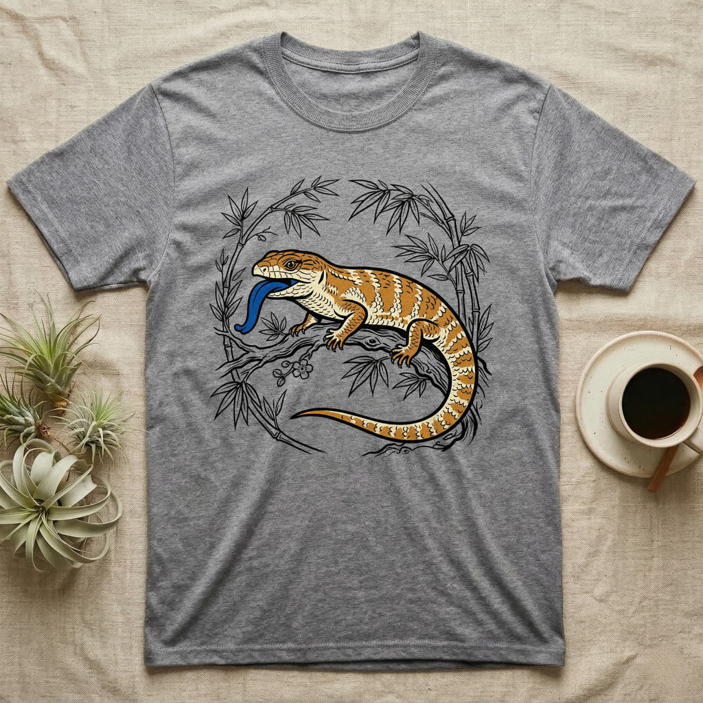 Grey t-shirt with illustrated bearded dragon and blue tongue among bamboo.