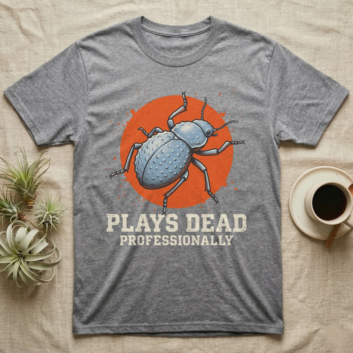 Blue Death Feigning Beetle T-Shirt in Sport Grey — Distressed disc portrait of a blue death-feigning beetle over an orange circle with text plays dead
