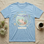Light blue t-shirt with axolotl in a jar design, "soft & slimy & sweet" text.