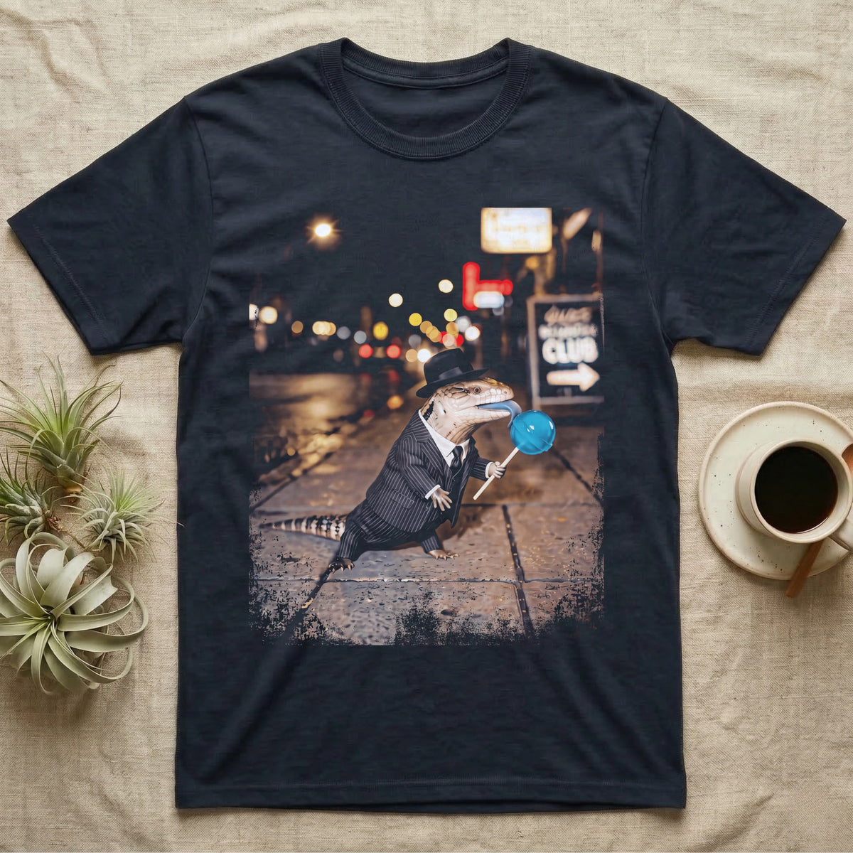 Blue Tongue Skink Detective T-Shirt in Navy — Blue-tongued skink in a pinstripe suit and fedora holding a blue lollipop on a neon-lit rainy street.
