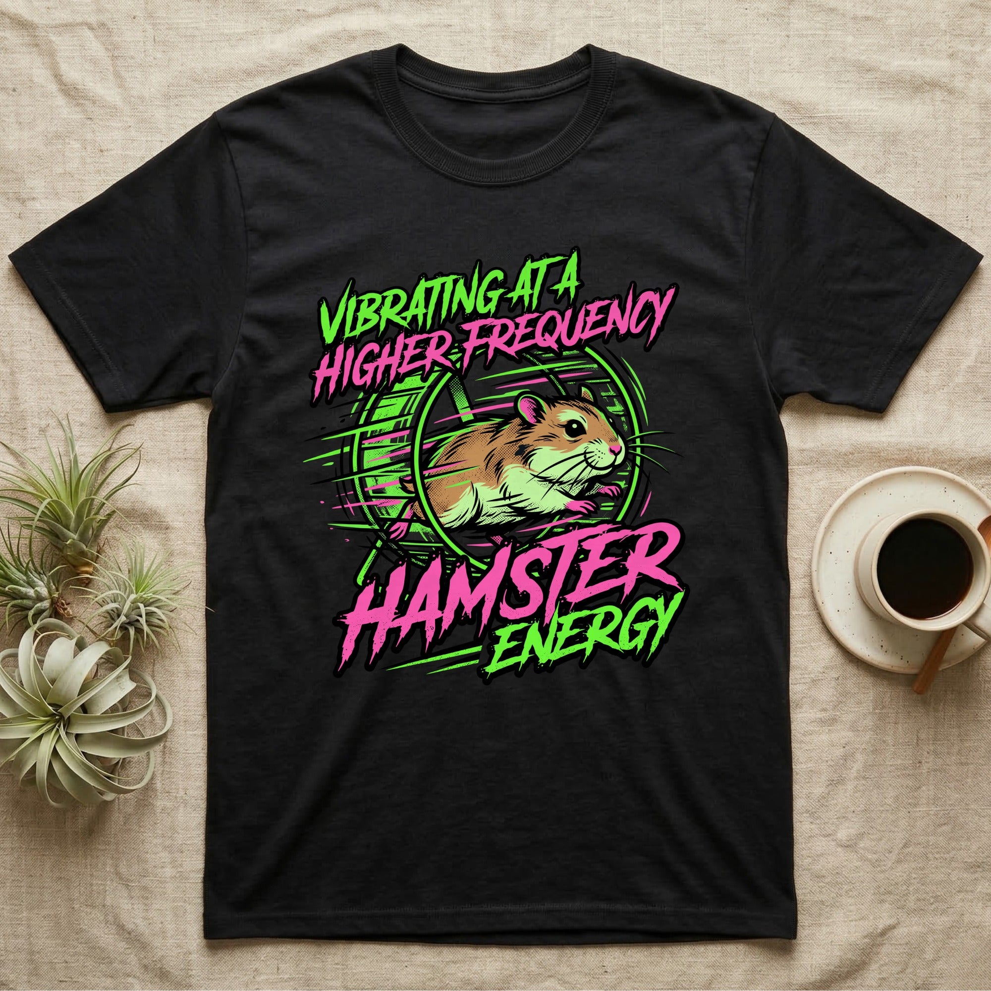 Black t-shirt with neon green and pink graphic of a hamster in a wheel.