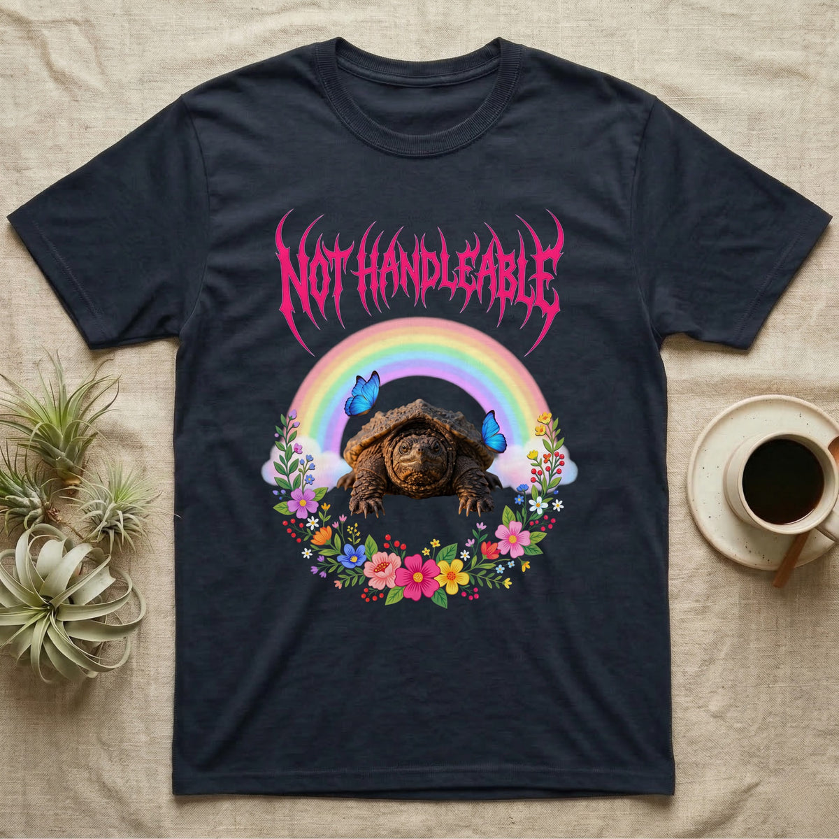 Snapping Turtle Hatchling T-Shirt in Navy — Cute baby snapping turtle in a pastel rainbow and flower wreath under a hot pink metal logo reading NOT HANDLEABLE