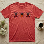 Velvet Spider Triptych T-Shirt in Heather Red — Three velvet spiders in a row, painted in thick impasto, each with a differently coloured red-and-black abdomen.