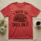 Box Turtle Overthinker T-Shirt in Heather Red — Etching of a box turtle half-closed in its shell beside a strawberry, under I NEED TO, above SHELL ON IT