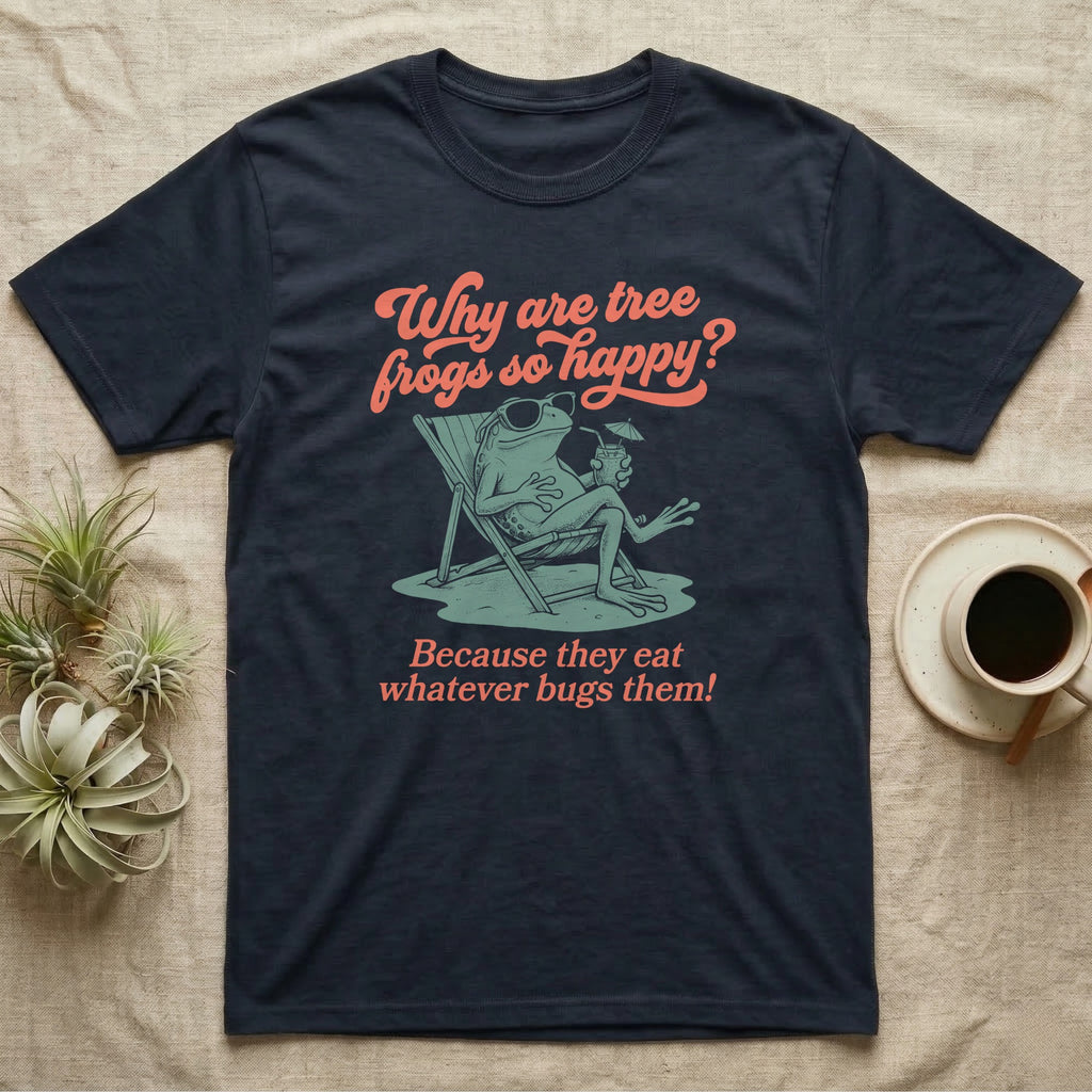 Green Tree Frog Sun Chair T-Shirt in Navy — Illustrated green tree frog reclining on a beach chair with sunglasses and a cocktail, coral script asking why tree frogs are so happy because they eat whatever bugs them.