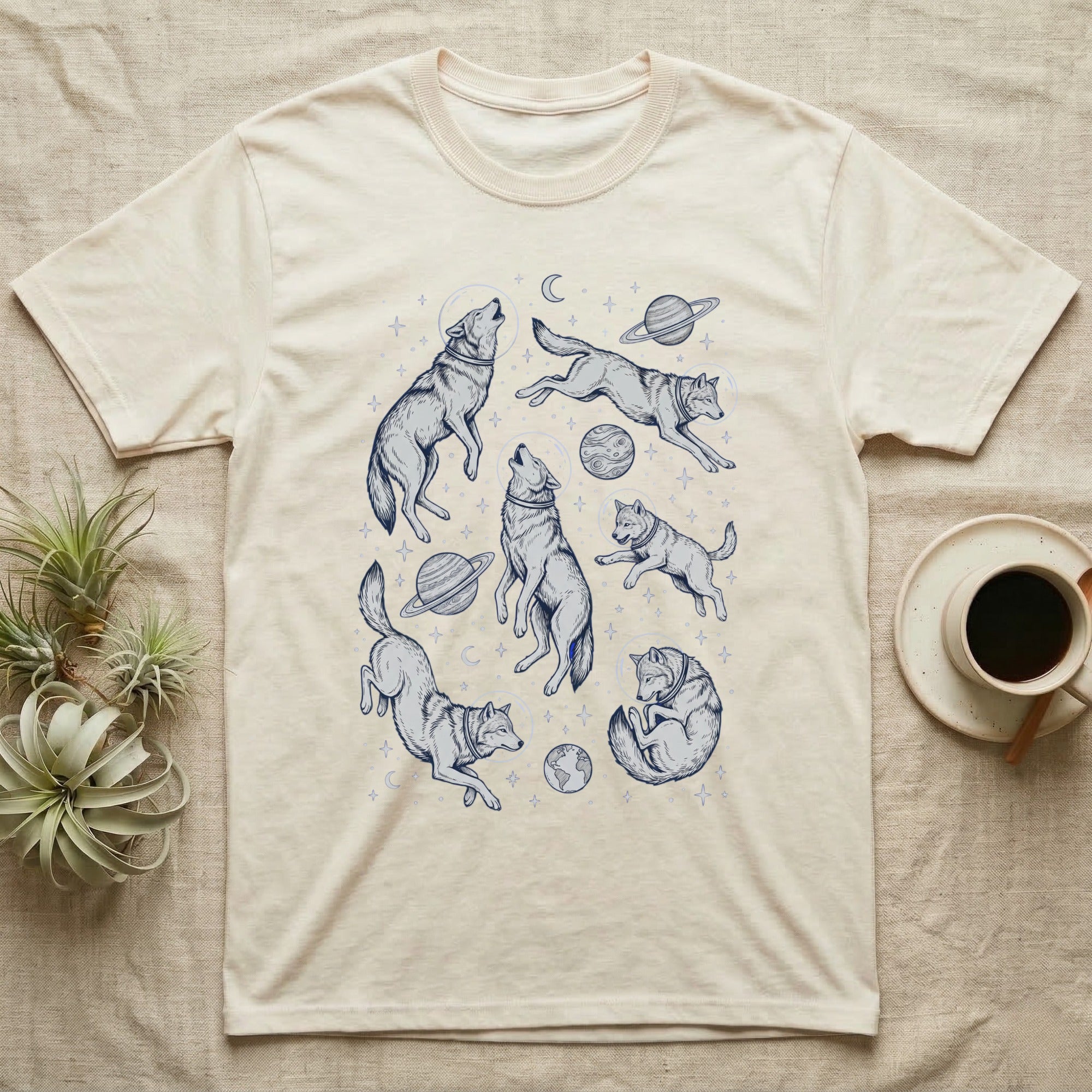 Cream t-shirt with celestial wolf graphics and planets.