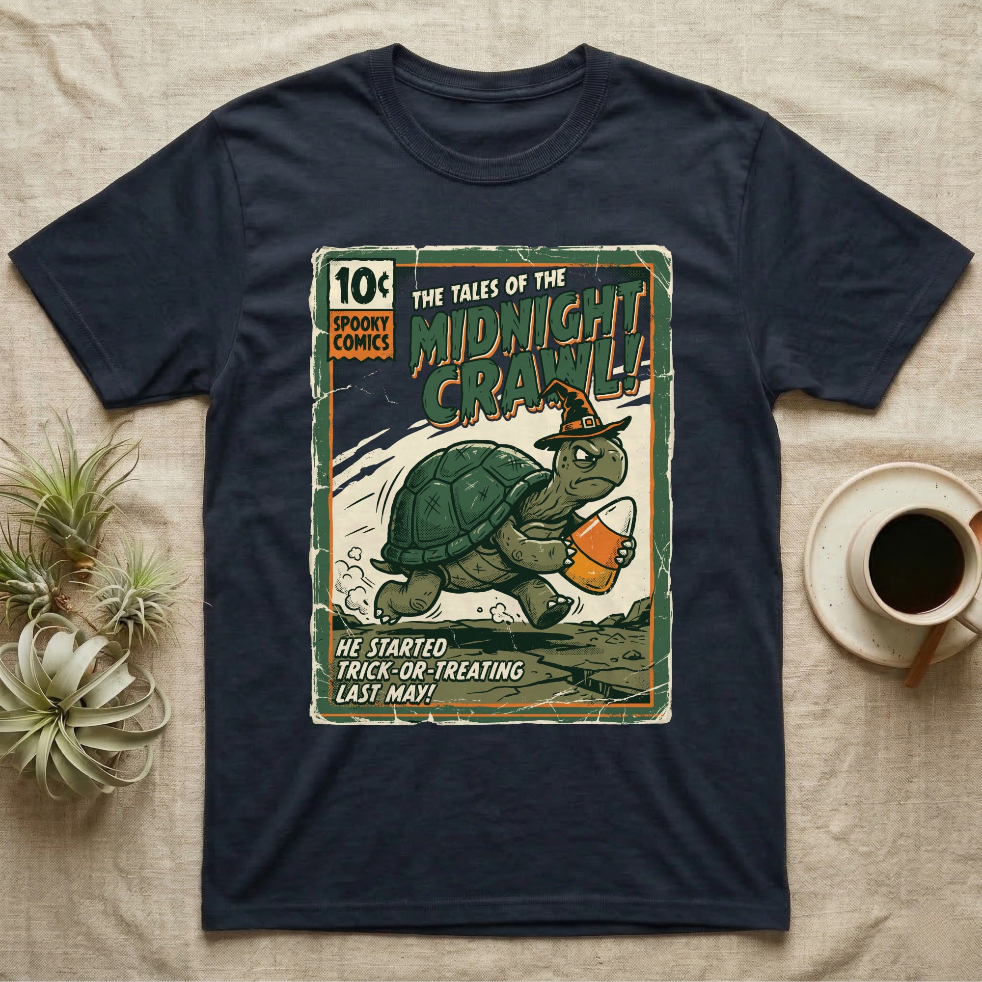 Tortoise Midnight Crawl Vintage T-Shirt in Navy — Worn pulp comic cover of a witch-hatted tortoise dashing with a candy pail, "Tales of the Midnight Crawl."