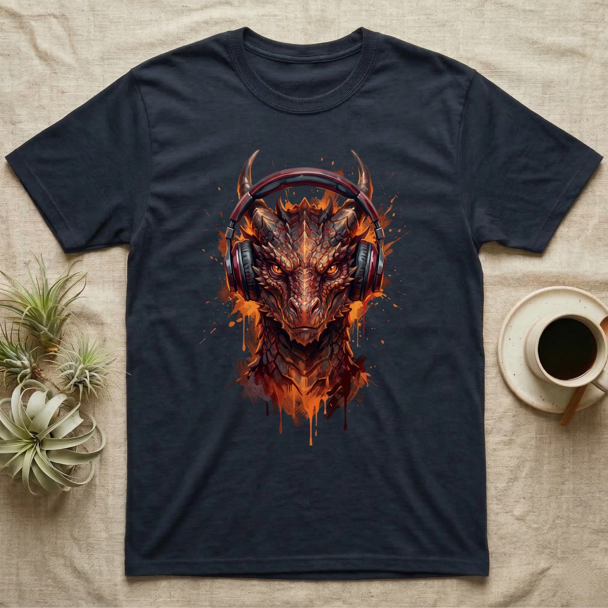Dark t-shirt with a graphic of a fiery dragon wearing red headphones.