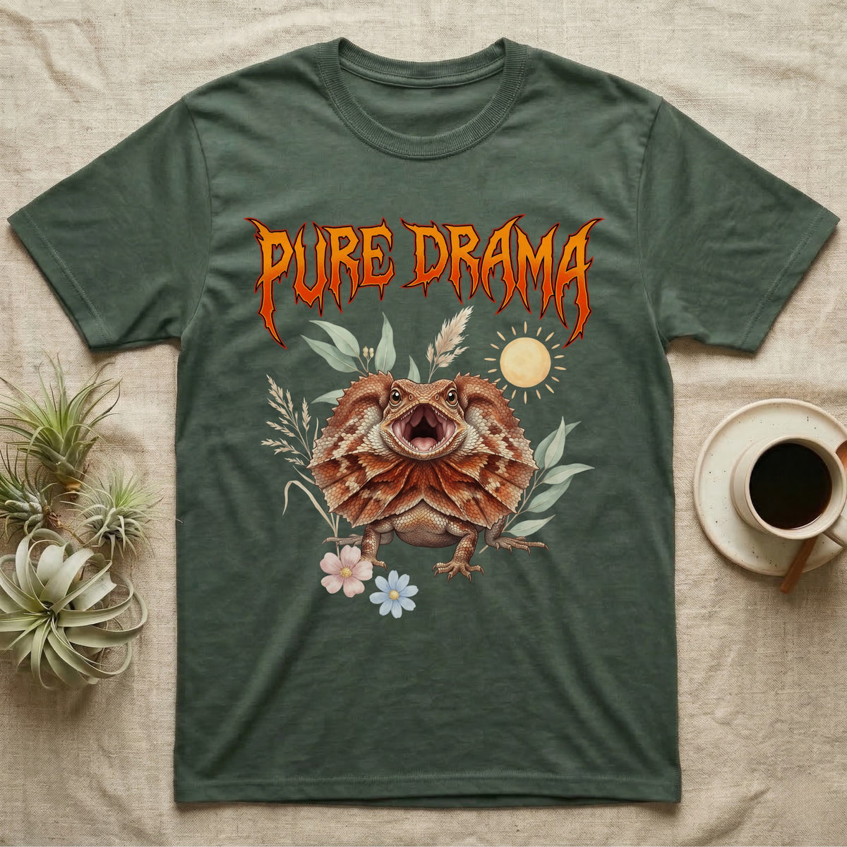 Frilled Dragon Feral T-Shirt in Military Green — Frilled dragon with its neck frill flared and mouth gaping under a jagged fiery-orange metal "PURE DRAMA" wordmark.
