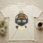 Penguin wearing headphones and sunglasses, reflecting mountains on a cream t-shirt.