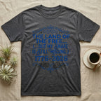 Corn Snake Still Missing Tee in Dark Heather — Royal blue typographic tee reading The land of the free but my snake is still missing, with Victorian filigree and small coiled corn snakes.