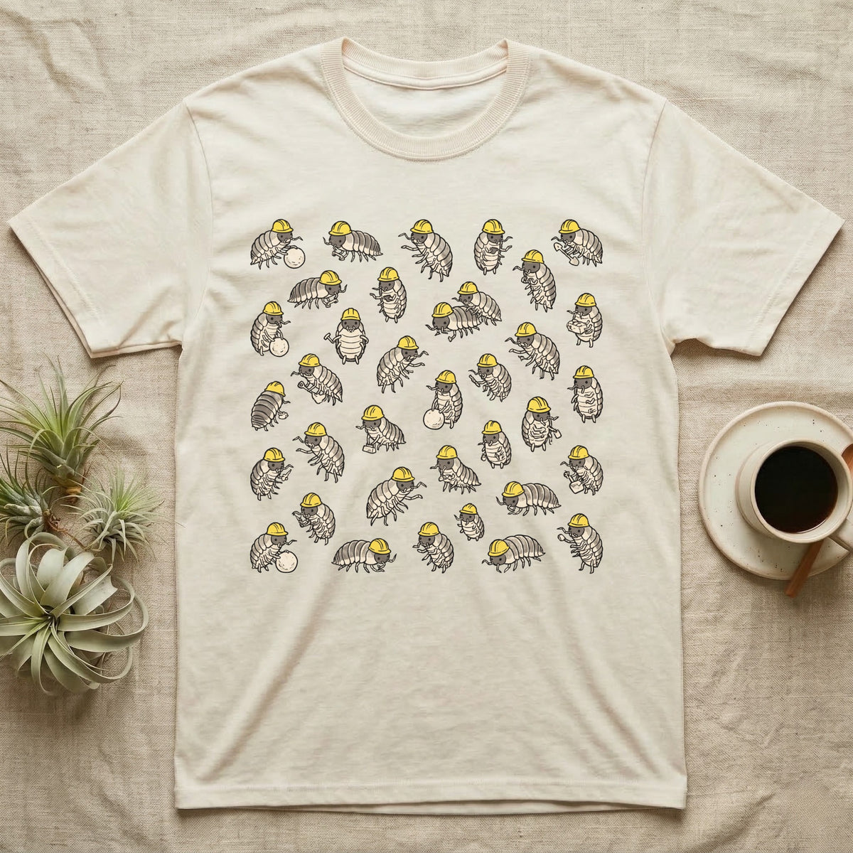 Isopod Cleanup Crew T-Shirt in Natural — Flat all-over scatter of cheerful isopods in tiny hi-vis hard-hats as a bioactive cleanup crew on shift.