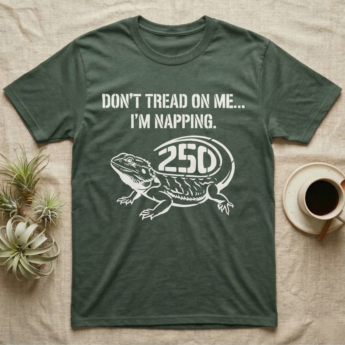 Bearded Dragon Napping T-Shirt in Military Green — White stencil bearded dragon resting with 250 cut into the tail under text Don't Tread On Me, I'm Napping.