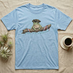 Tree Frog Freedom T-Shirt in Light Blue — Detailed green tree frog in a tricorn hat on a ribboned branch under script Celebrating 250 Years of Freedom.