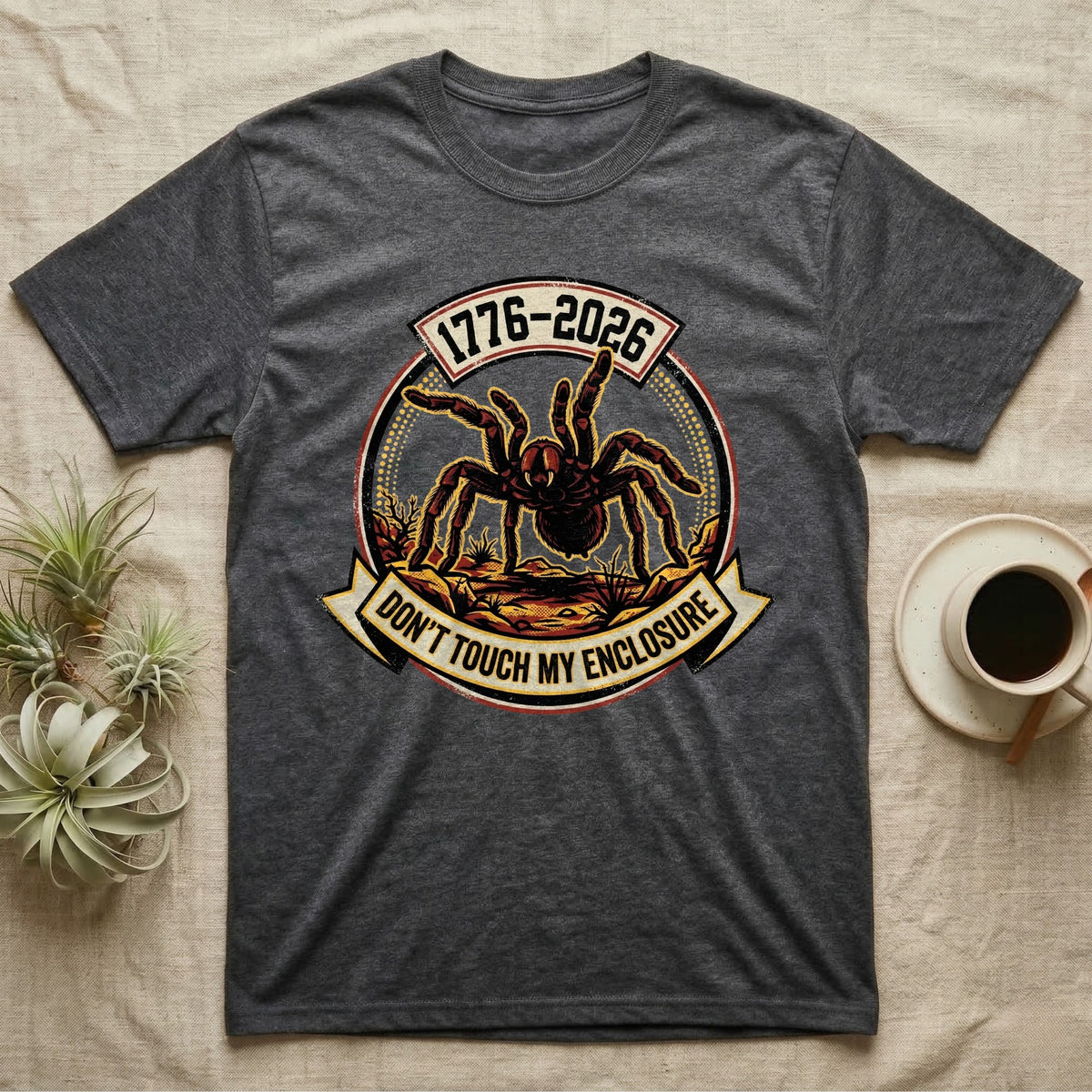 Tarantula Don't Touch Enclosure Tee in Dark Heather — Distressed circular badge of a defensive tarantula on desert ground, red and gold banner reading Don't Touch My Enclosure, on black.
