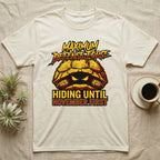 Tortoise Maximum Defense Force T-Shirt in Natural — Metal graphic of a tortoise glaring from its shell, "Maximum Defense Force, Hiding Until November First."