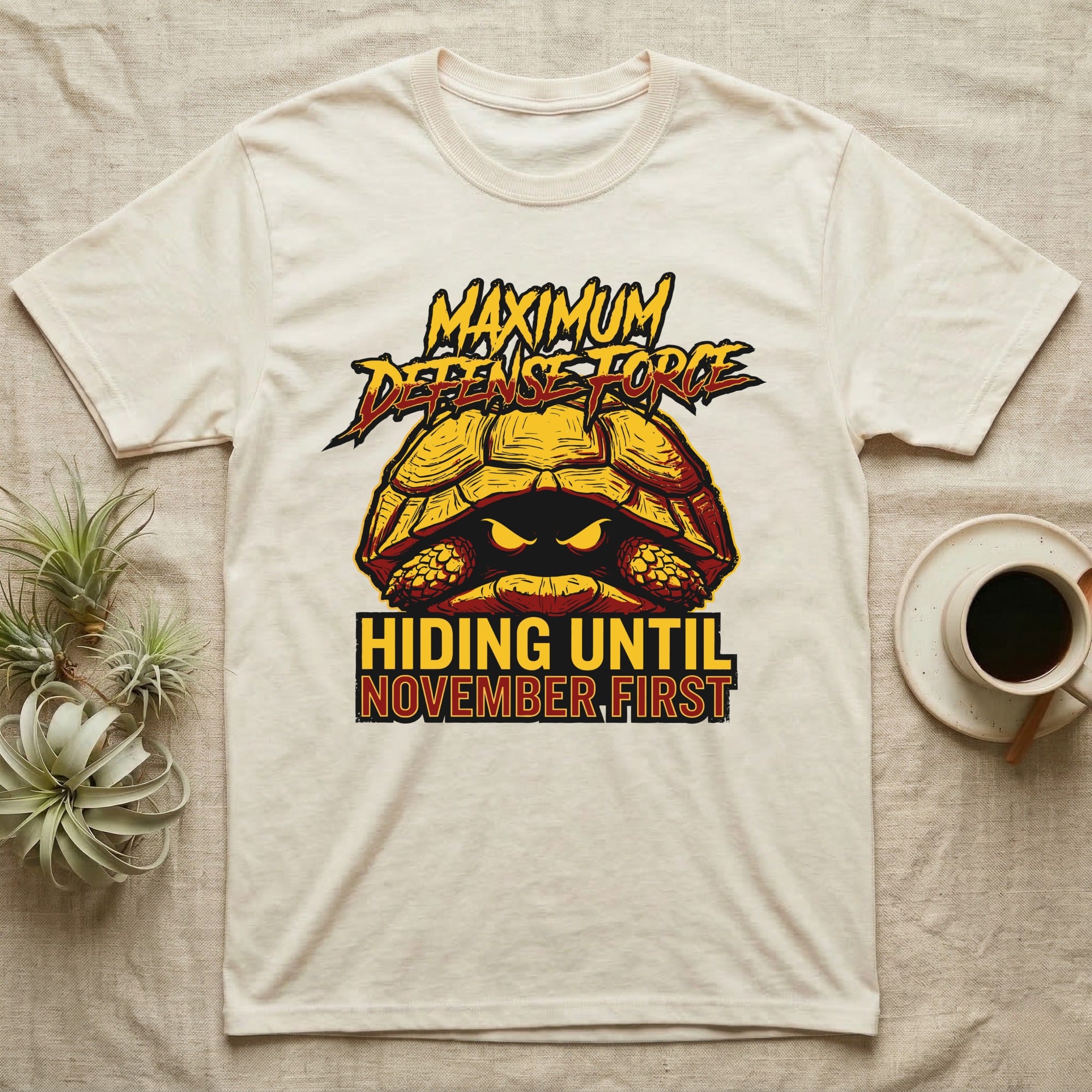 Tortoise Maximum Defense Force T-Shirt in Natural — Metal graphic of a tortoise glaring from its shell, "Maximum Defense Force, Hiding Until November First."