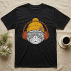 Corn Snake Chill Beats T-Shirt in Black — Engraved corn snake in a knit beanie and headphones, aviator lenses reflecting a leafy forest floor.