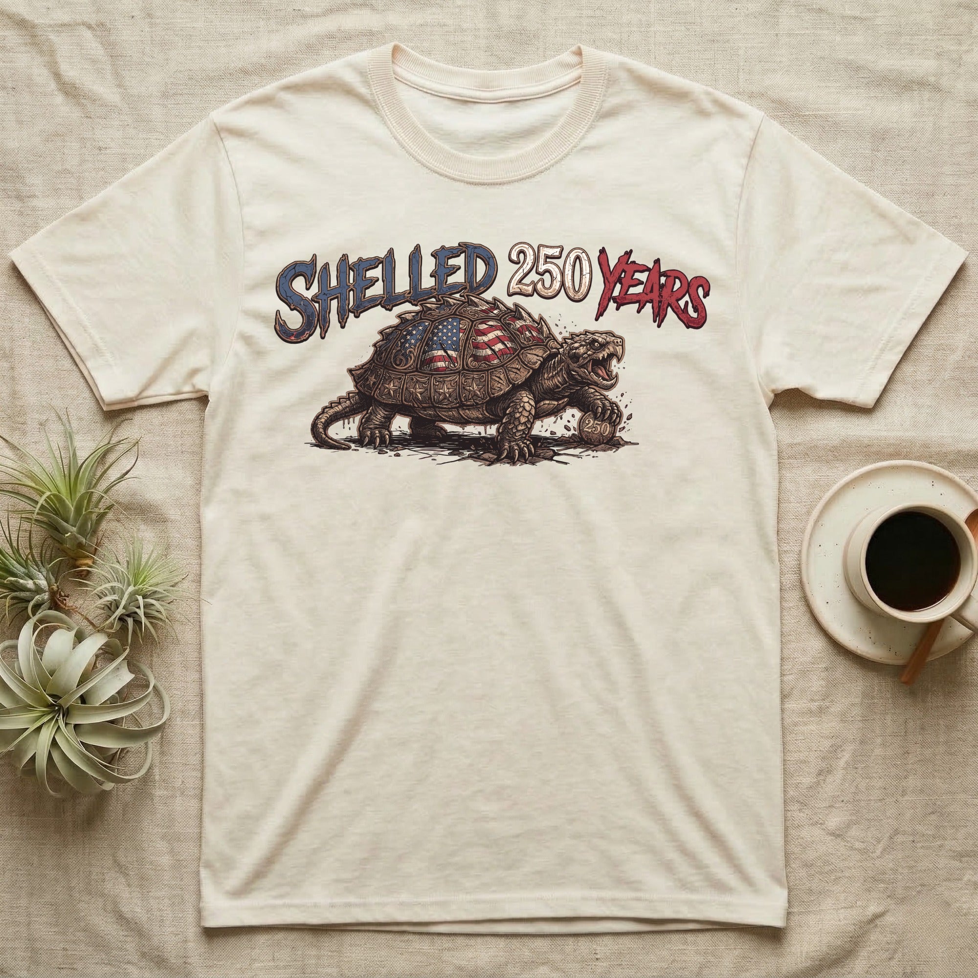 Snapping Turtle 250 T-Shirt in Natural — Gritty woodcut alligator snapping turtle with a flag-etched shell on a 250 coin under text Shelled 250 Years.
