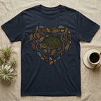 Navy t-shirt with a heart-shaped design of a turtle, leaves, and rocks.