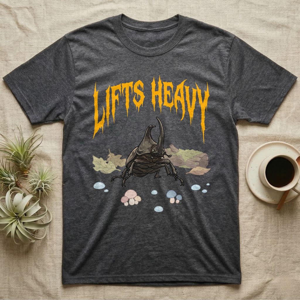 Rhino Beetle Feral T-Shirt in Dark Heather — Horned rhinoceros beetle standing head-on below a dripping amber-gold metal "Lifts Heavy" wordmark