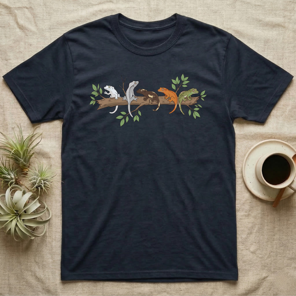 Crested Gecko Morph Line T-Shirt in Navy — Five crested gecko morphs in ink and watercolour perched along one cork bark branch with ficus leaves.