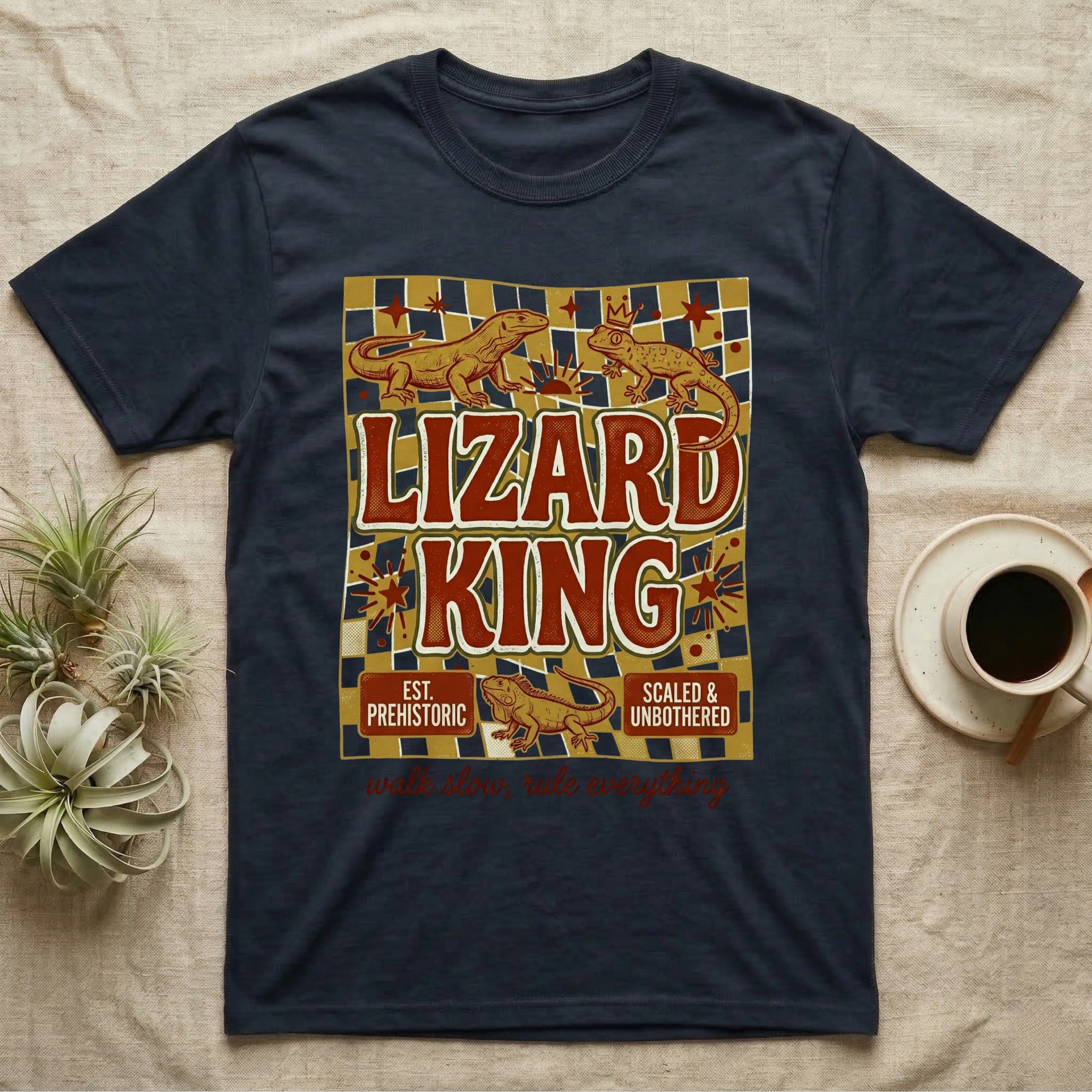 Navy t-shirt with "Lizard King Est. Prehistoric Scaled & Unbothered" text and lizards.