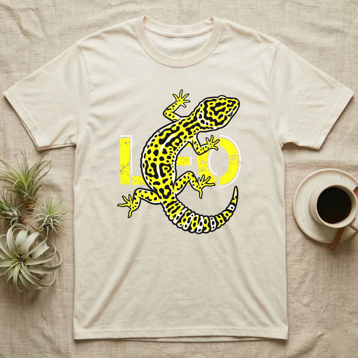 Cream t-shirt with a yellow and black leopard gecko design and "LO" text.