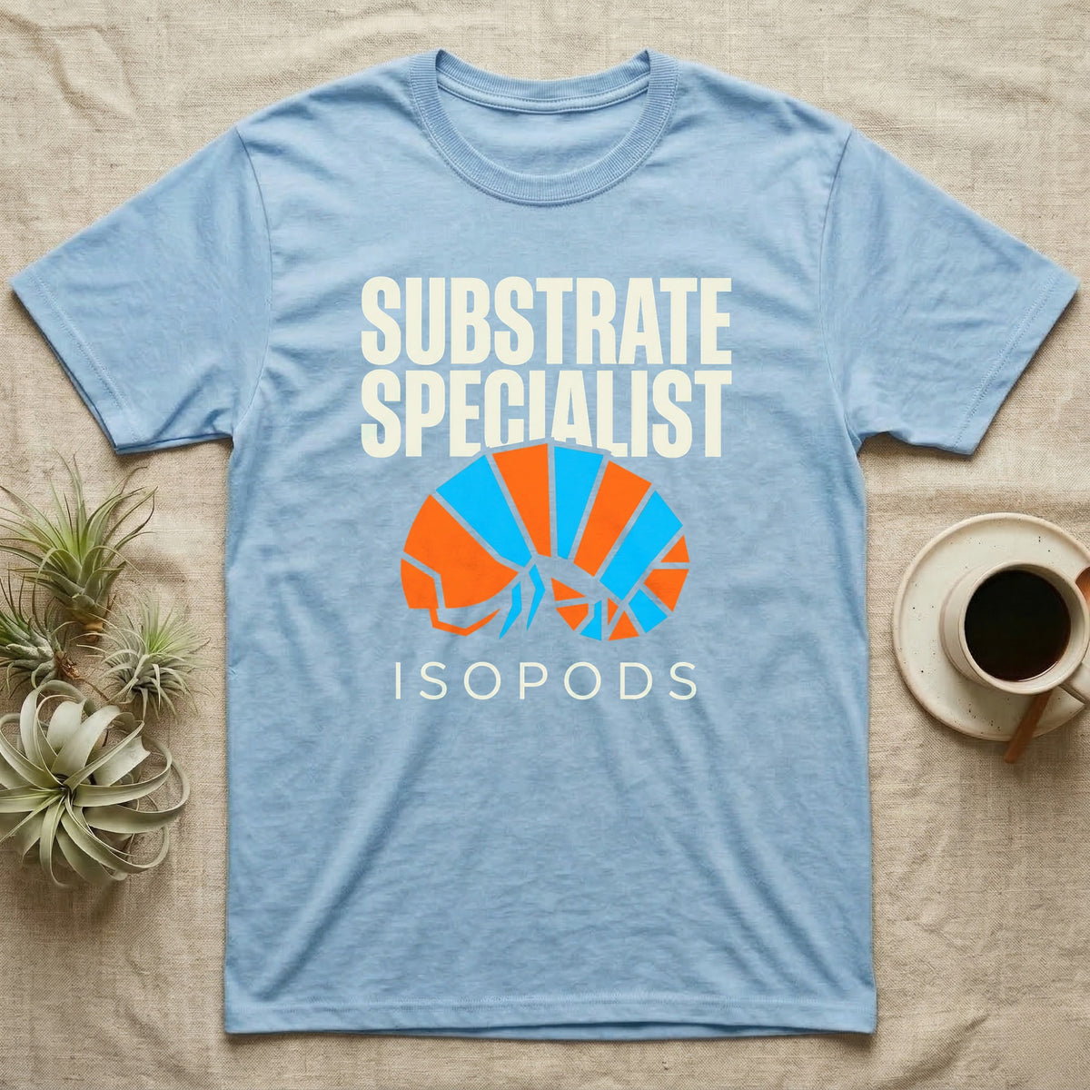 Isopod Substrate Specialist T-Shirt in Light Blue — Geometric orange and blue rolled isopod between bold "Substrate Specialist" and "Isopods" lettering.
