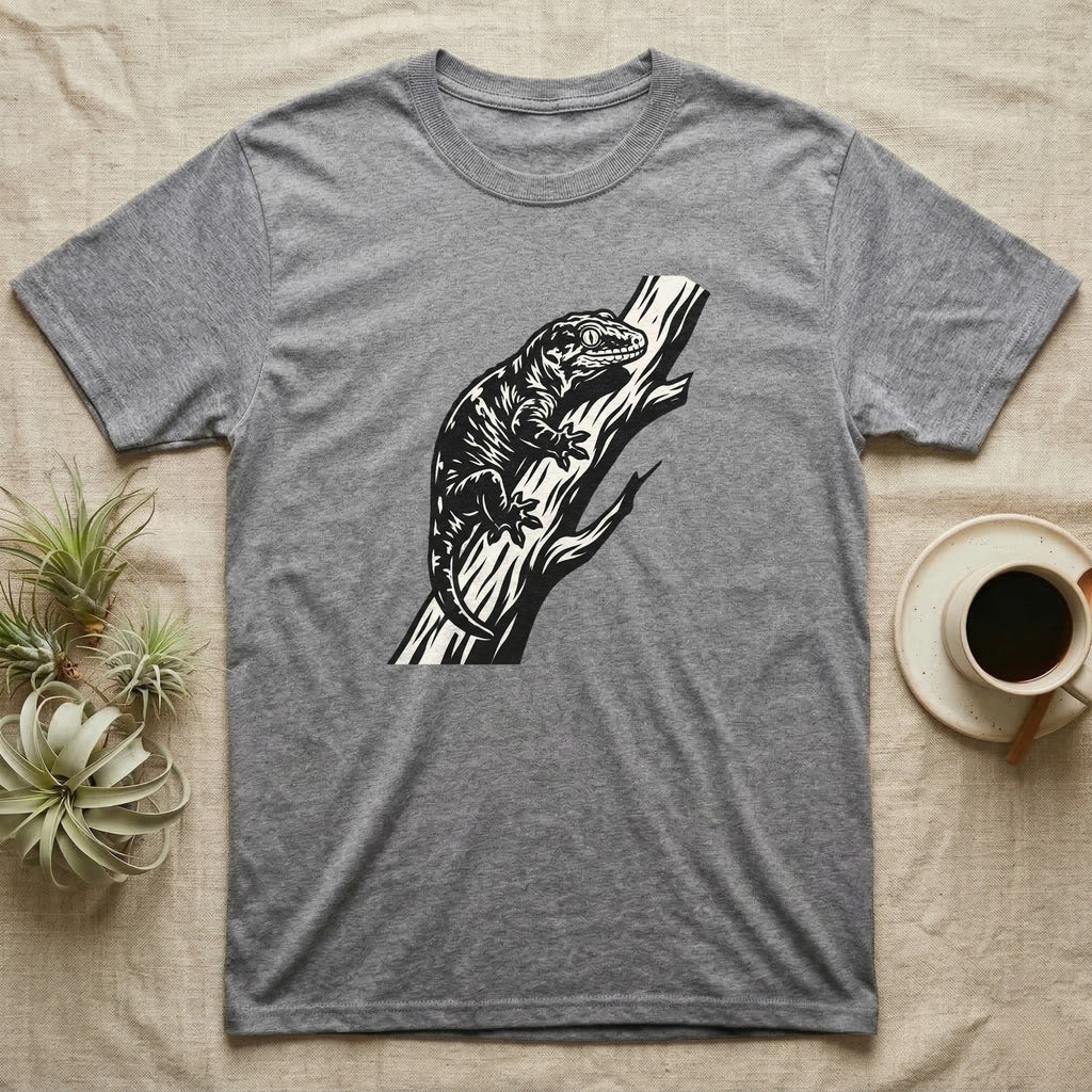 Grey t-shirt with black lizard illustration on a branch.