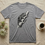 Grey t-shirt with black lizard illustration on a branch.