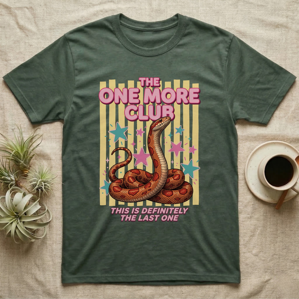 Corn Snake Club T-Shirt in Military Green — Engraved corn snake sitting deadpan under pink lettering The One More Club, with This is definitely the last one below, on yellow stripes