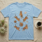 Light blue t-shirt with floating tigers in space with planets.