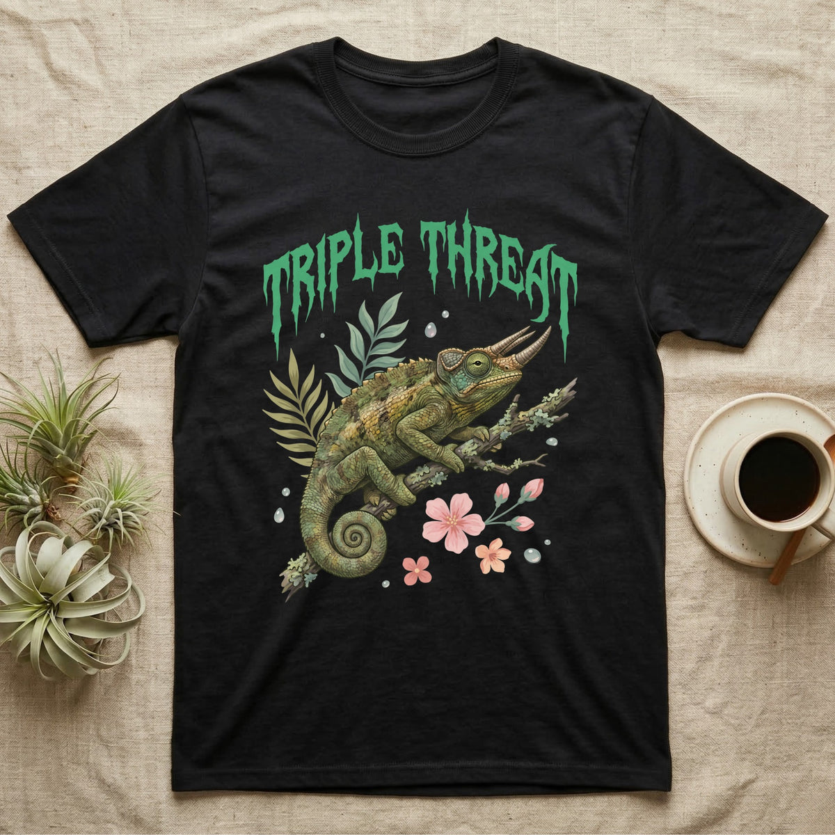 Jackson's Chameleon Feral T-Shirt in Black — Three-horned Jackson's chameleon on a branch below a dripping jade-green metal "Triple Threat" wordmark