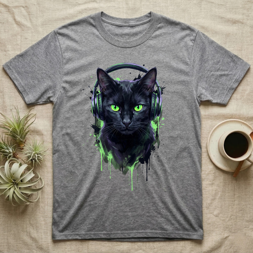 Black cat with green eyes wearing headphones, splattered paint design.