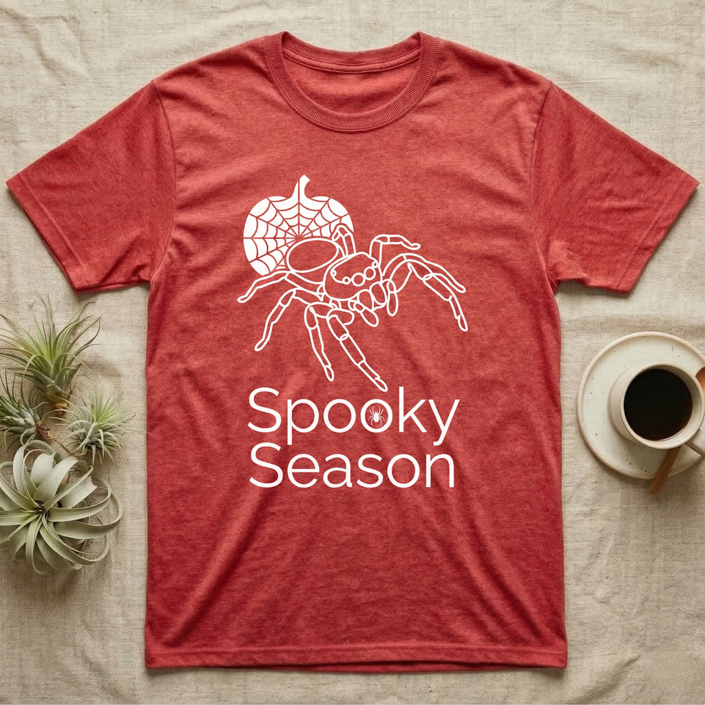 Jumping Spider Spooky Season T-Shirt in Heather Red — Minimal continuous-line jumping spider over a spiderweb pumpkin, text "Spooky Season" with a spider in the O.